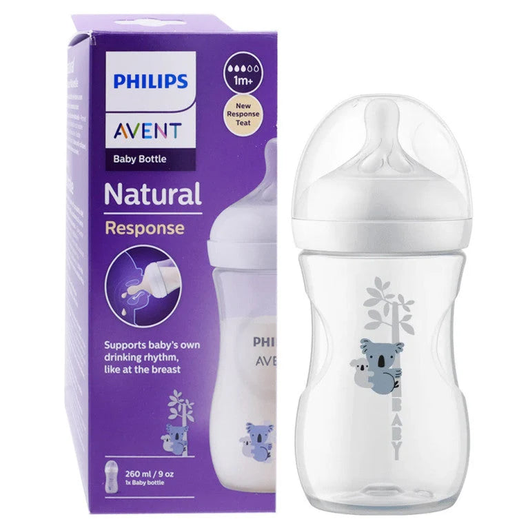 Clear 260ml plastic bottle with grey koala pattern, white ring and dome cap next to purple box